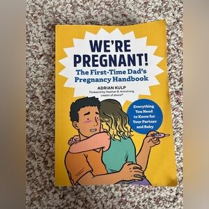 WE'RE PREGNANT! The First-Time Dad's Pregnancy Handbook book - Yellow Cover